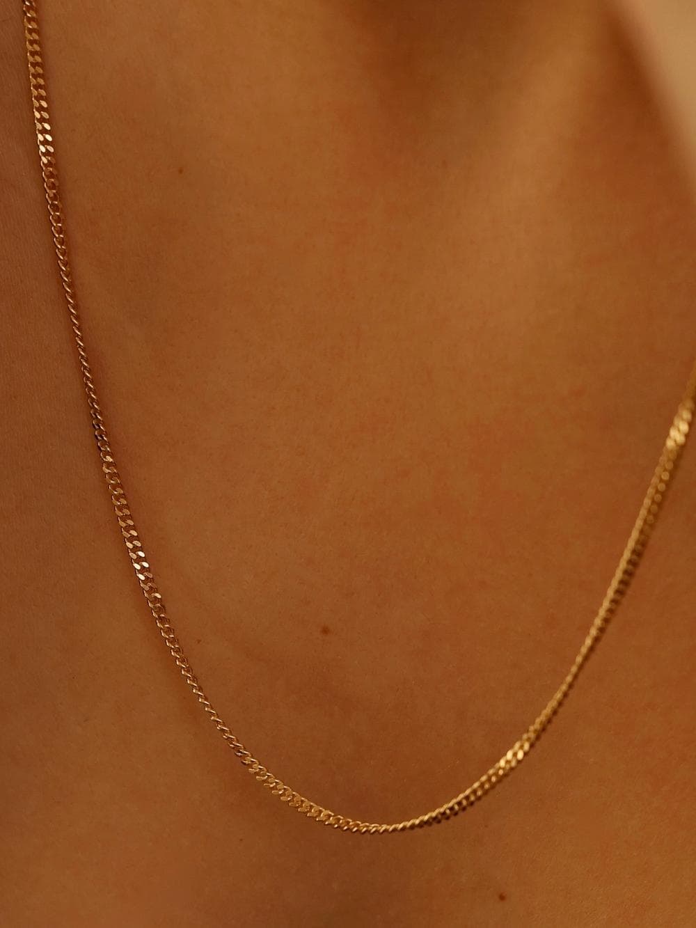 Herringbone Chain full view in yellow gold