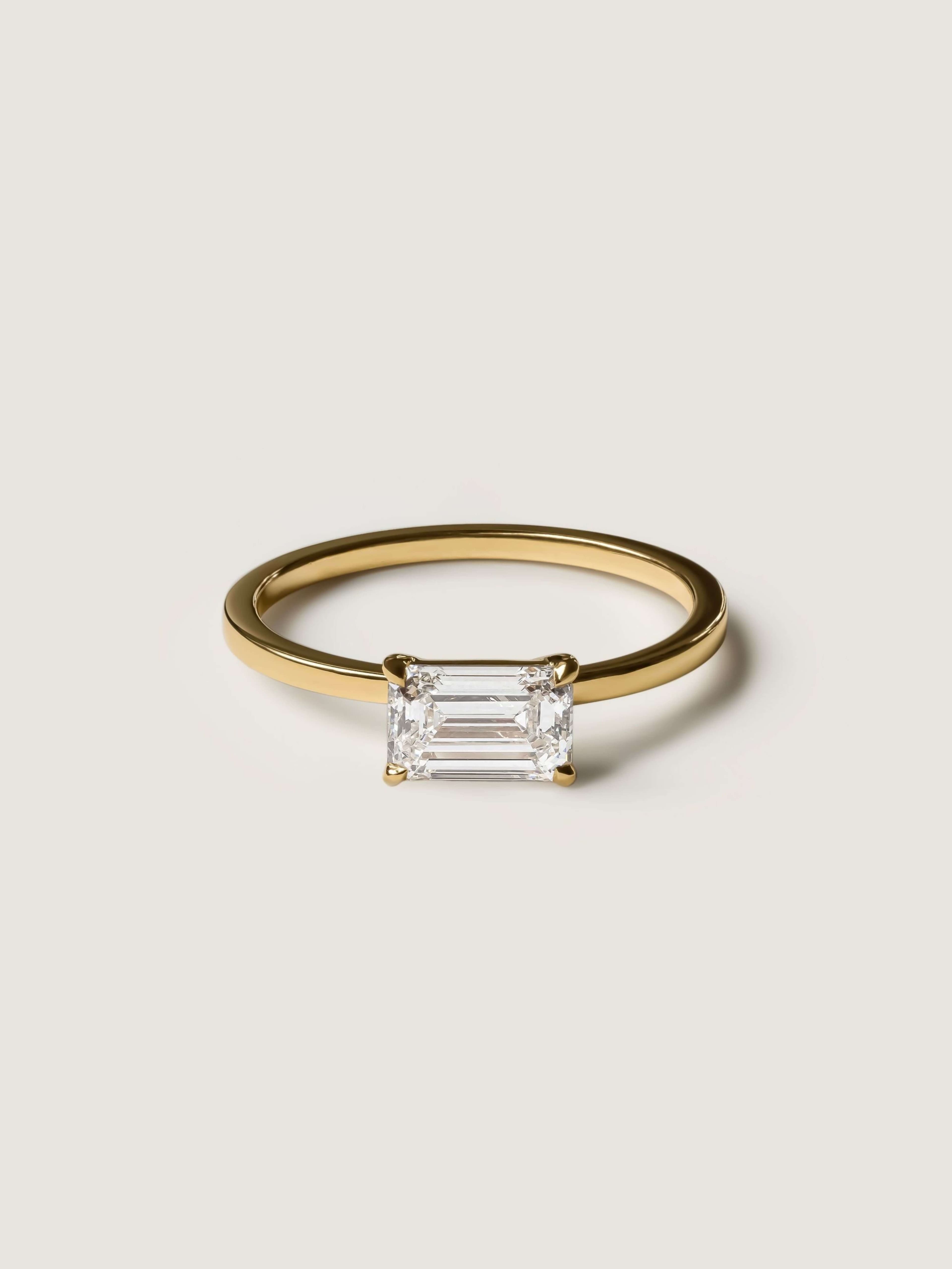 Classic Emerald Cut E-W Ring in yellow gold